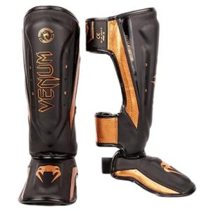 Venum Elite Evo benskydd svart/brons L 3611441626970 Venum Elite Evo benskydd svart/brons L 3611441626970